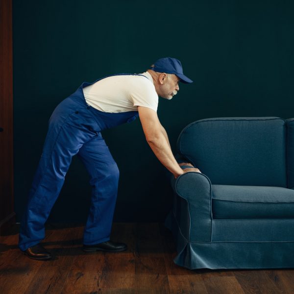 elderly-cargo-man-in-uniform-moves-sofa.jpg